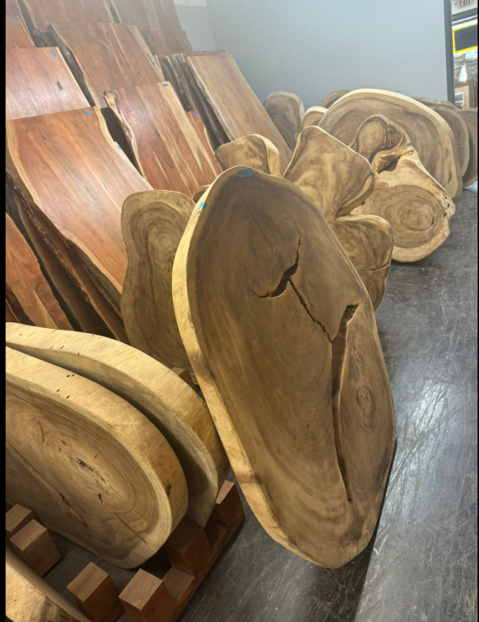 Natural wood slabs available for customers to choose in the warehouse